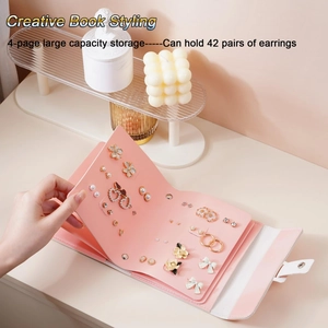 Pink faux leather travel earring organizer book with 4 pages for 42 pairs of earrings