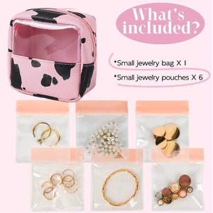 Pink cow print travel jewelry case with clear PVC window and six sealing bags