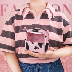 Pink cow print travel jewelry case with transparent PVC window and zipper closure
