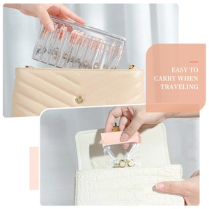 Pink 10-grid acrylic jewelry organizer box with EVA bags inside a quilted handbag