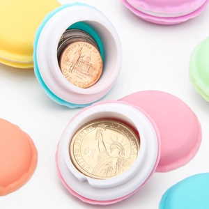 Close-up of colorful macaron storage cases for coins and jewelry in various pastel shades