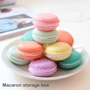 Colorful macaron shaped mini jewelry storage boxes for necklaces and earrings organized in tray