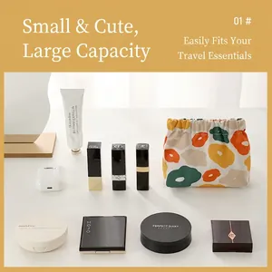 Waterproof floral travel pouch showing capacity for lipstick and small makeup items