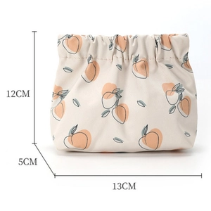 Detail showing peach print canvas mini pouch with dimensions 12cm by 13cm for storage