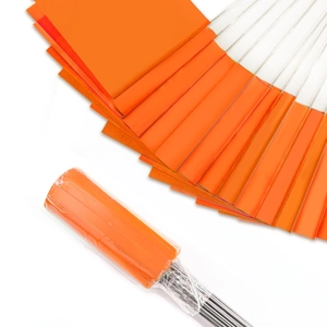 Close-up of bright orange PVC marking flags with durable steel wires in retail packaging