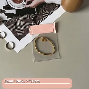 Small pink transparent EVA jewelry storage bag 7x10cm with golden bead bracelet