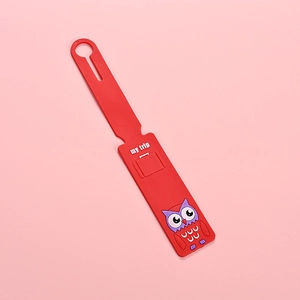 Red silicone luggage tag with cute owl design and my trip text on pink background