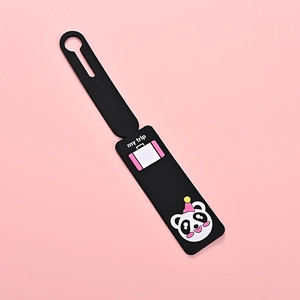 Close-up of a black PVC luggage tag featuring a cute panda design and my trip text