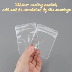 Close-up of thick transparent PVC jewelry bag showing scratch-resistant material and seal