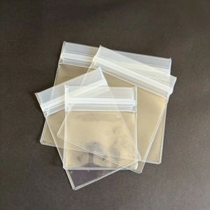 Close-up of various sizes of transparent ziplock jewelry bags for storage