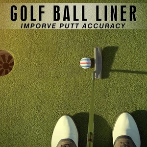 Golf ball liner tool showing red and blue alignment lines on a ball on putting green