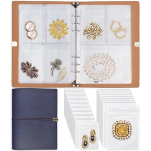 Close-up of PVC jewelry organizer book showing anti-oxidation pouches for earrings and rings
