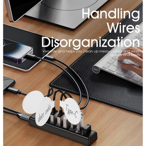 32pcs silicone cable organizers and tags on desk with tablet and keyboard