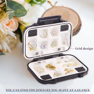Detail view of double-layer jewelry box with grid design for rings and necklaces