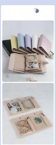 Quilted leather jewelry organizer roll with transparent compartments and interior details