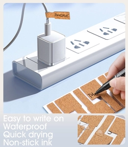Waterproof cork cable labels on white charger wire for cable management and organization