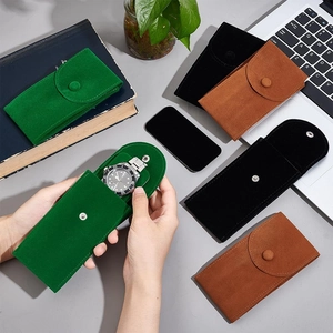 Portable suede watch pouches in green, black and brown for travel protection