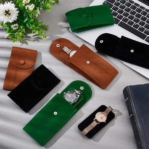 Portable suede watch pouches in green, tan and black with secure snap button closure