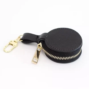Portable round genuine leather jewelry case with gold zipper and swivel hook