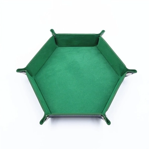 Detail of the green velvet lining and snap buttons on the hexagonal leather dice tray
