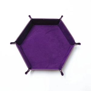 Flat lay of a purple hexagonal dice tray made of PU leather and velvet with metal snaps