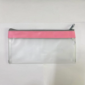 Detail of pink trim on waterproof frosted PVC pencil case with a grey zipper closure