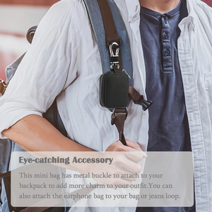 Black leather headphone case with silver lobster clasp attached to a backpack strap