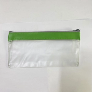 Detail of waterproof frosted PVC pencil case with green edge trim and smooth zipper closure