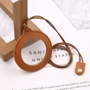 Portable leather magnifying glass with brown neck strap and high magnification lens