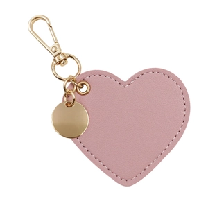 Detail of pink PU leather heart keychain with gold clasp and white stitching detail