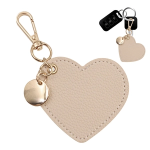 Detail of heart-shaped PU leather keychain with neat stitching and gold lobster clasp