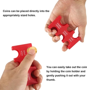 Detail view of red portable coin holder showing manual storage and removal process