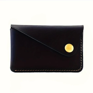 Minimalist black crazy horse leather card holder with gold snap and contrast stitching