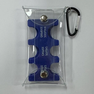 Close-up of portable coin organizer with blue plastic holder and clear PVC storage pouch