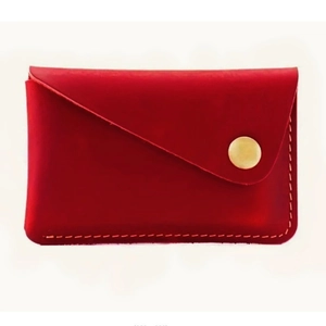Minimalist red leather card holder with vintage style and golden metal snap fastener