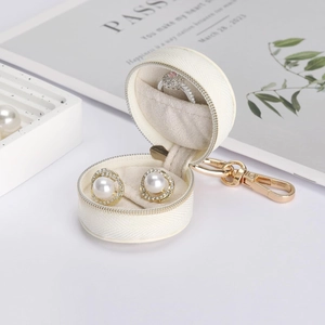 Portable mini round jewelry box with gold clip for earrings and rings storage