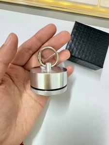 Detail of a portable mini aluminum jewelry box with a waterproof seal and keychain loop