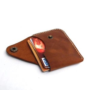 Handmade brown leather card holder with snap button closure and retro envelope design