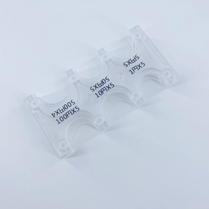 Macro view of clear plastic coin sorter showing specific slots for Japanese yen coins