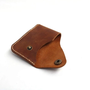 Handmade brown leather card holder with vintage metal snap closure and hand stitching