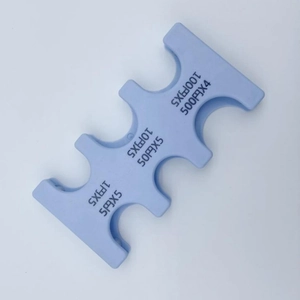 Detailed view of light blue Japanese coin holder showing specific currency slots