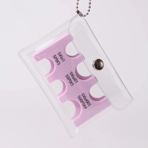 Macro detail of portable Japanese coin organizer with pink slots and clear PVC pouch