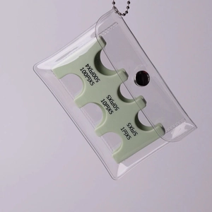 Detail view of the mint green Japanese coin organizer with slots for all denominations
