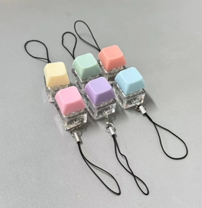 Macro view of 6-piece macaron-colored mechanical keyboard switch fidget keychains