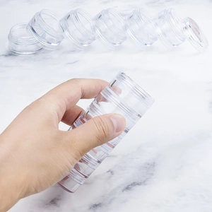Stackable 6-layer clear jewelry storage boxes for rings and necklaces organized on marble