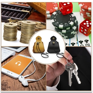 Detailed views of mini leather drawstring pouches in yellow and black for versatile storage