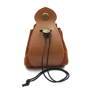 Close-up of vintage brown leather dice bag with drawstring and snap button closure