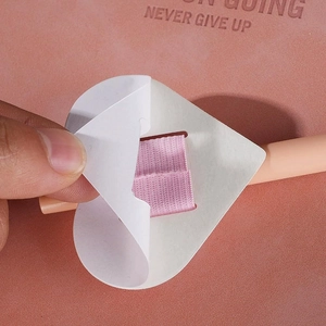 Self-adhesive pink elastic pen loop holder for notebooks and tablets with white round base