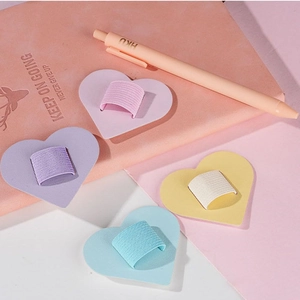 Close-up of four macaron-colored heart-shaped self-adhesive PU leather pen holders