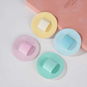 Macro shot of macaron colored PU leather elastic pen holders for laptops and notebooks